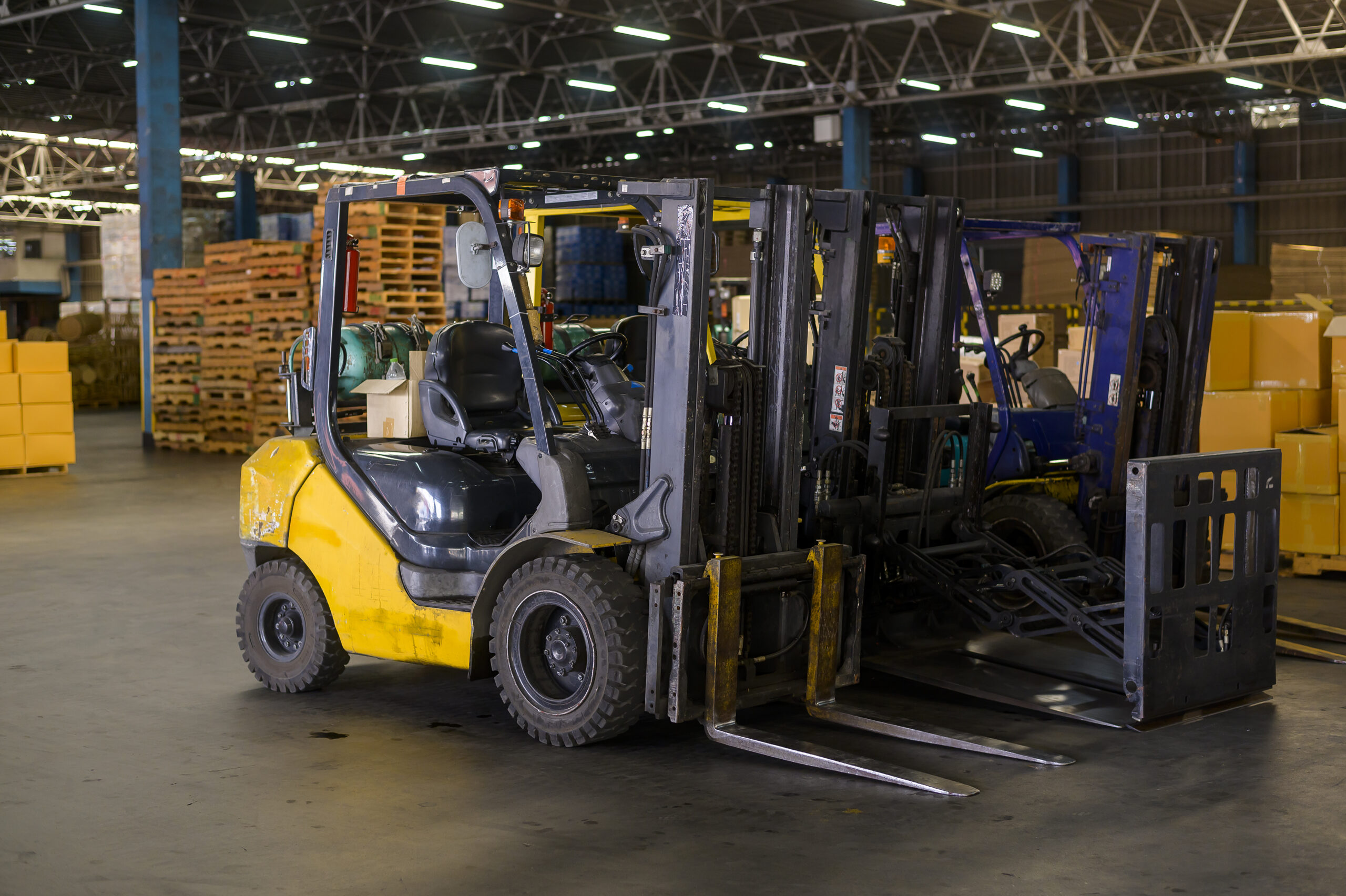 Forklift loader in warehouse, machinery and Logistics concept.